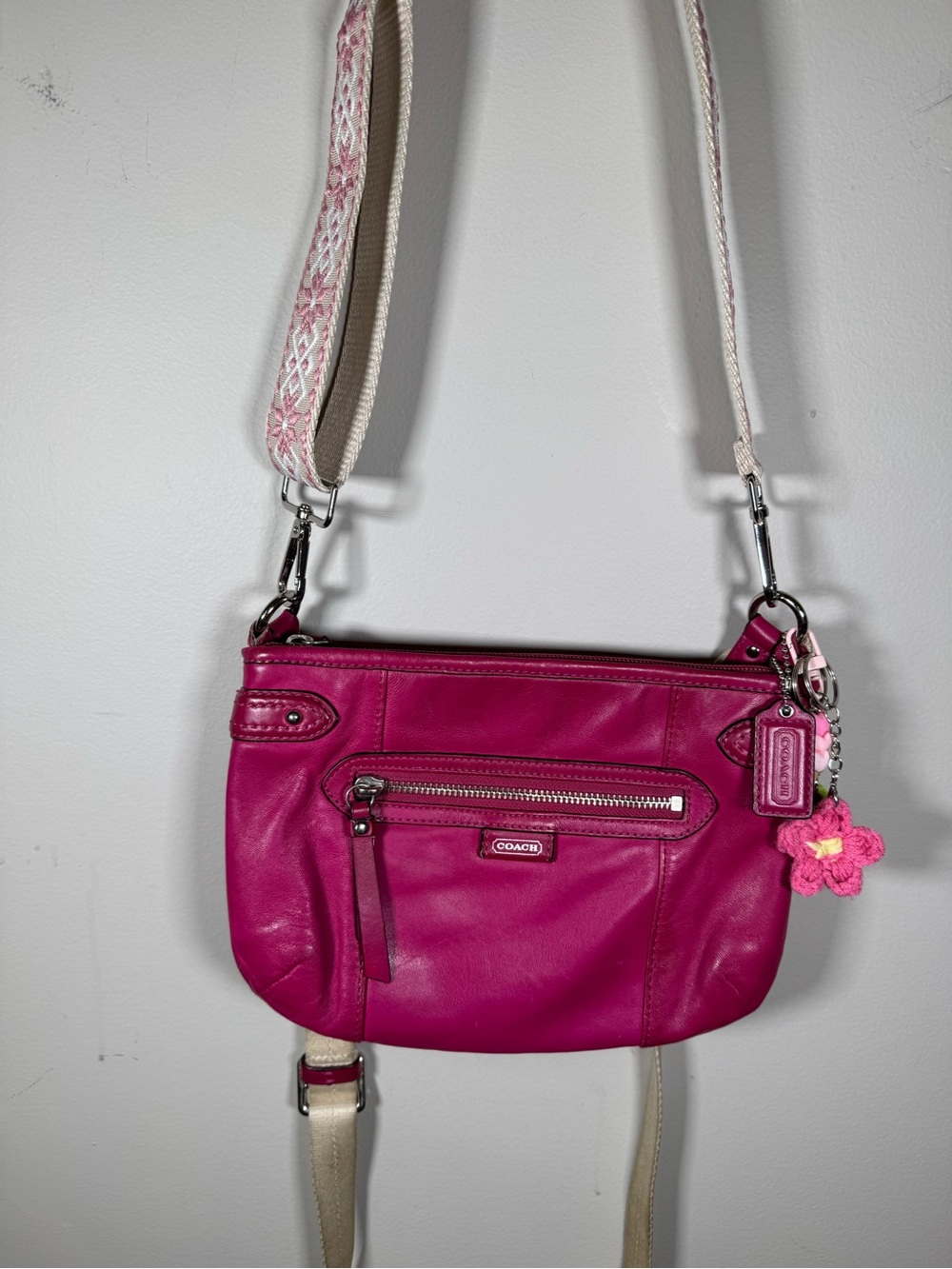 Coach Hot Pink Leather Crossbody Bag with Guitar strap and Floral Charm.